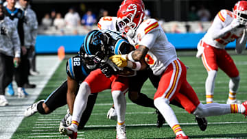 Nov 24, 2024; Charlotte, North Carolina, USA; Carolina Panthers wide receiver Deven Thompkins (13) is tackled by Kansas City Chiefs safety Nazeeh Johnson (13) and Kansas City Chiefs safety Bryan Cook (6) defend in the first quarter at Bank of America Stadium. Mandatory Credit: Bob Donnan-Imagn Images