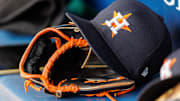 Apr 27, 2025; Kansas City, Missouri, USA; Houston Astros hat and glove in the dugout during the second inning against the Kansas City Royals at Kauffman Stadium.