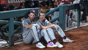 Jun 24, 2024; Omaha, NE, USA;  Texas A&M Aggies third baseman Gavin Grahovac (9) and designated hitter Hayden Schott (5) look over the field after the loss against the Tennessee Volunteers.
