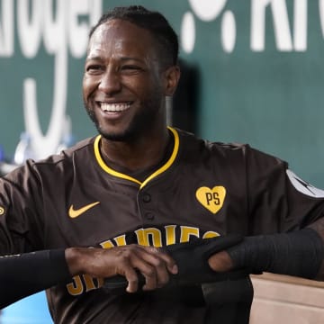 Jul 4, 2024; Arlington, Texas, USA; San Diego Padres outfielder Jurickson Profar (10) smiles in the dugout after scoring against the Texas Rangers during the fourth inning at Globe Life Field. Mandatory Credit: Raymond Carlin III-USA TODAY Sports