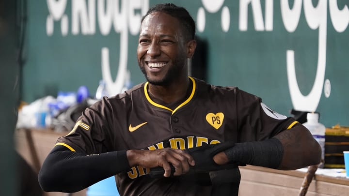 Jul 4, 2024; Arlington, Texas, USA; San Diego Padres outfielder Jurickson Profar (10) smiles in the dugout after scoring against the Texas Rangers during the fourth inning at Globe Life Field. Mandatory Credit: Raymond Carlin III-USA TODAY Sports