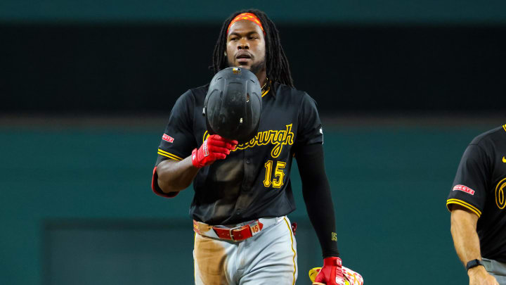 Aug 20, 2024; Arlington, Texas, USA; Pittsburgh Pirates designated hitter Oneil Cruz (15) reacts after hitting an rbi triple during the fourth inning against the Texas Rangers at Globe Life Field. Mandatory Credit: Kevin Jairaj-USA TODAY Sports