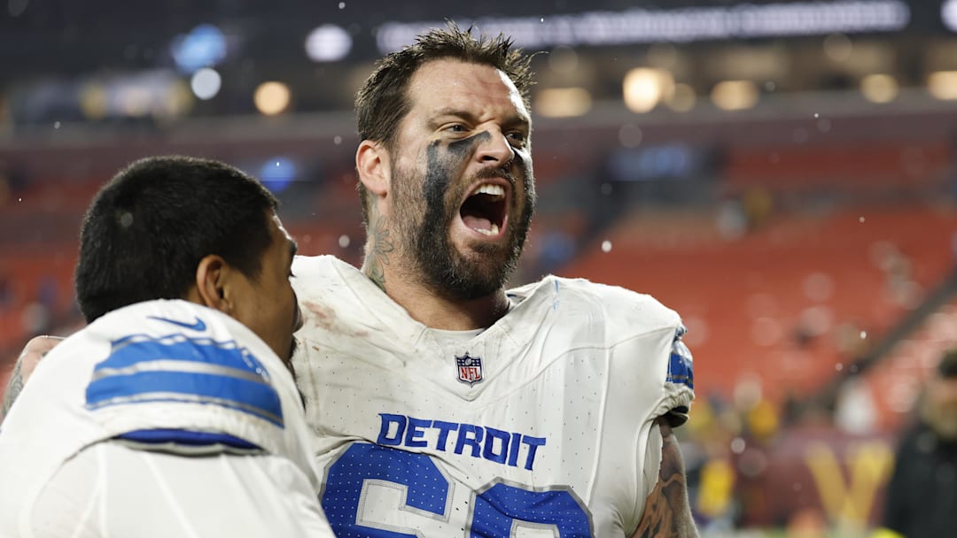 Nov 9, 2025; Landover, Maryland, USA; Detroit Lions offensive tackle Penei Sewell (L) celebrates with Lions offensive tackle Taylor Decker (68) while leaving the field after their game against the Washington Commanders at Northwest Stadium. Mandatory Credit: Geoff Burke-Imagn Images