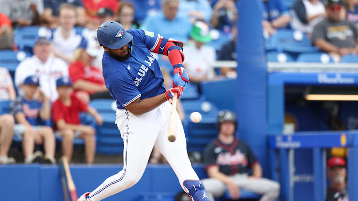 Mar 16, 2025; Dunedin, Florida, USA; Toronto Blue Jays first baseman Vladimir Guerrero Jr. (27) breaks his bat on a ground ball against the Atlanta Braves in the fifth inning during spring training at TD Ballpark. Mandatory Credit: Nathan Ray Seebeck-Imagn Images