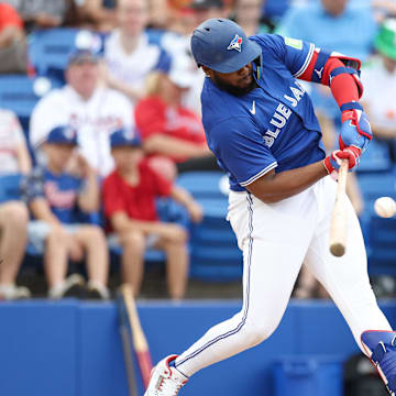 Mar 16, 2025; Dunedin, Florida, USA; Toronto Blue Jays first baseman Vladimir Guerrero Jr. (27) breaks his bat on a ground ball against the Atlanta Braves in the fifth inning during spring training.