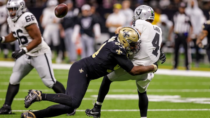 Oct 30, 2022; New Orleans Saints defensive end Cameron Jordan (94) hits Raiders quarterback Derek Carr (4) as he throws 