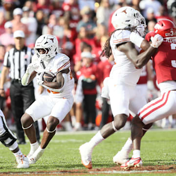 Nov 16, 2024; Fayetteville, Arkansas, USA; Texas Longhorns running back Quintrevion Wisner (26) rushes during the fourth quarter against the Arkansas Razorbacks at Donald W. Reynolds Razorback Stadium. Texas won 20-10. Mandatory Credit: Nelson Chenault-Imagn Images