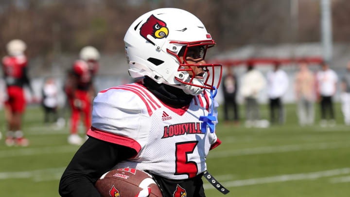 Louisville’s Caullin Lacy (5) caught the ball during spring practice Friday afternoon.