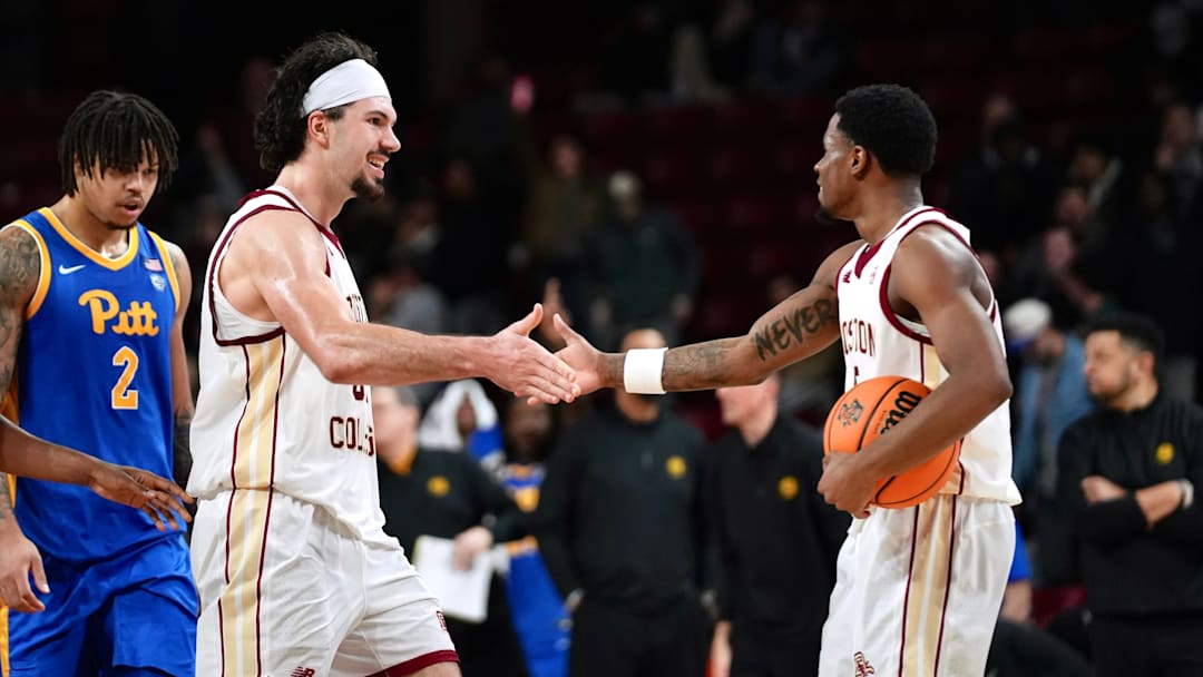 Boden Kapke high-fives Fred Payne after scoring the game-winning shot at Conte Forum on Jan. 21, 2026.