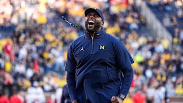 Michigan head coach Sherrone Moore fires up the student section during warm up ahead of the New Mexico game at Michigan Stadium in Ann Arbor on Saturday, August 30, 2025.
