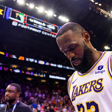 Feb 25, 2024; Phoenix, Arizona, USA; Los Angeles Lakers forward LeBron James (23) reacts as he walks off the court against the Phoenix Suns at Footprint Center. Mandatory Credit: Mark J. Rebilas-Imagn Images