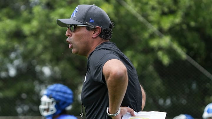 New Kentucky offensive coordinator Bush Hamdan coaches during practice Friday. August 2, 2024 in Lexington. Hamdan came from Boise State; he's also coached at Missouri, the Atlanta Falcons and Florida as well.