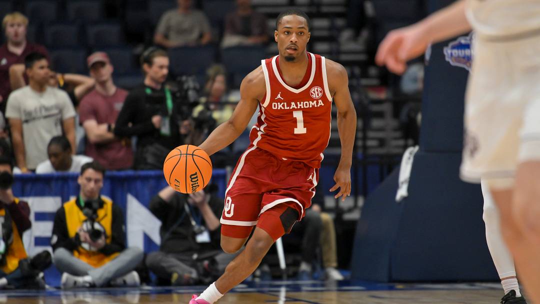 Mar 12, 2026; Nashville, TN, USA; Oklahoma Sooners guard Xzayvier Brown (1) brings the ball up court against the Texas A&M Aggies during the second half at Bridgestone Arena.