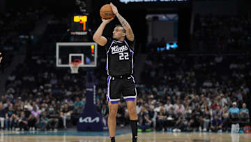 Apr 4, 2025; Charlotte, North Carolina, USA; Sacramento Kings guard Devin Carter (22) with a jump shot against the Charlotte Hornets during the second quarter at Spectrum Center. Mandatory Credit: Jim Dedmon-Imagn Images