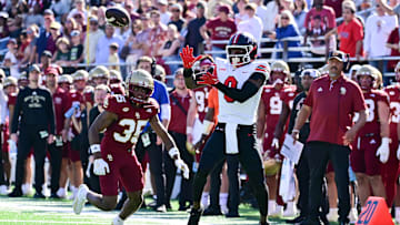 Sep 28, 2024; Chestnut Hill, Massachusetts, USA; Western Kentucky Hilltoppers wide receiver Kisean Johnson (0) tries to make a catch with pressure from Boston College Eagles defensive back Ashton McShane (35) during the second half at Alumni Stadium. Mandatory Credit: Eric Canha-Imagn Images