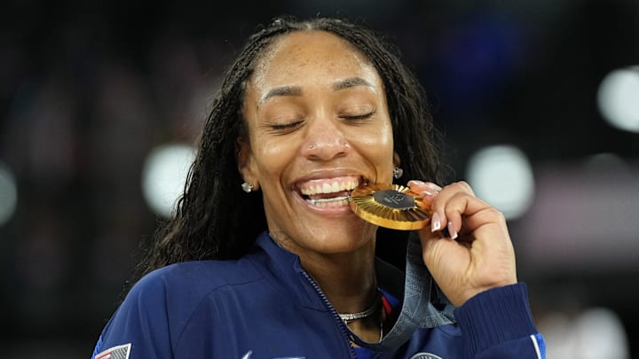 Aug 11, 2024; Paris, France; United States forward A'Ja Wilson (9) celebrates with the gold medal after defeating France in the women's gold medal game during the Paris 2024 Olympic Summer Games at Accor Arena. Mandatory Credit: Kyle Terada-Imagn Images