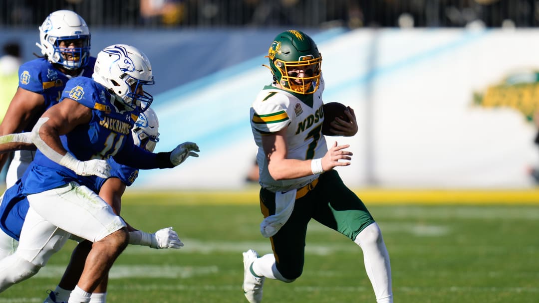 Jan 8, 2023; Frisco, Texas, US;  North Dakota State Bison quarterback Cam Miller (7) runs the ball and is chased by South Dakota State Jackrabbits linebacker Jason Freeman (11) during the first half of the DI Football Championship at Toyota Stadium. Mandatory Credit: Chris Jones-USA TODAY Sports