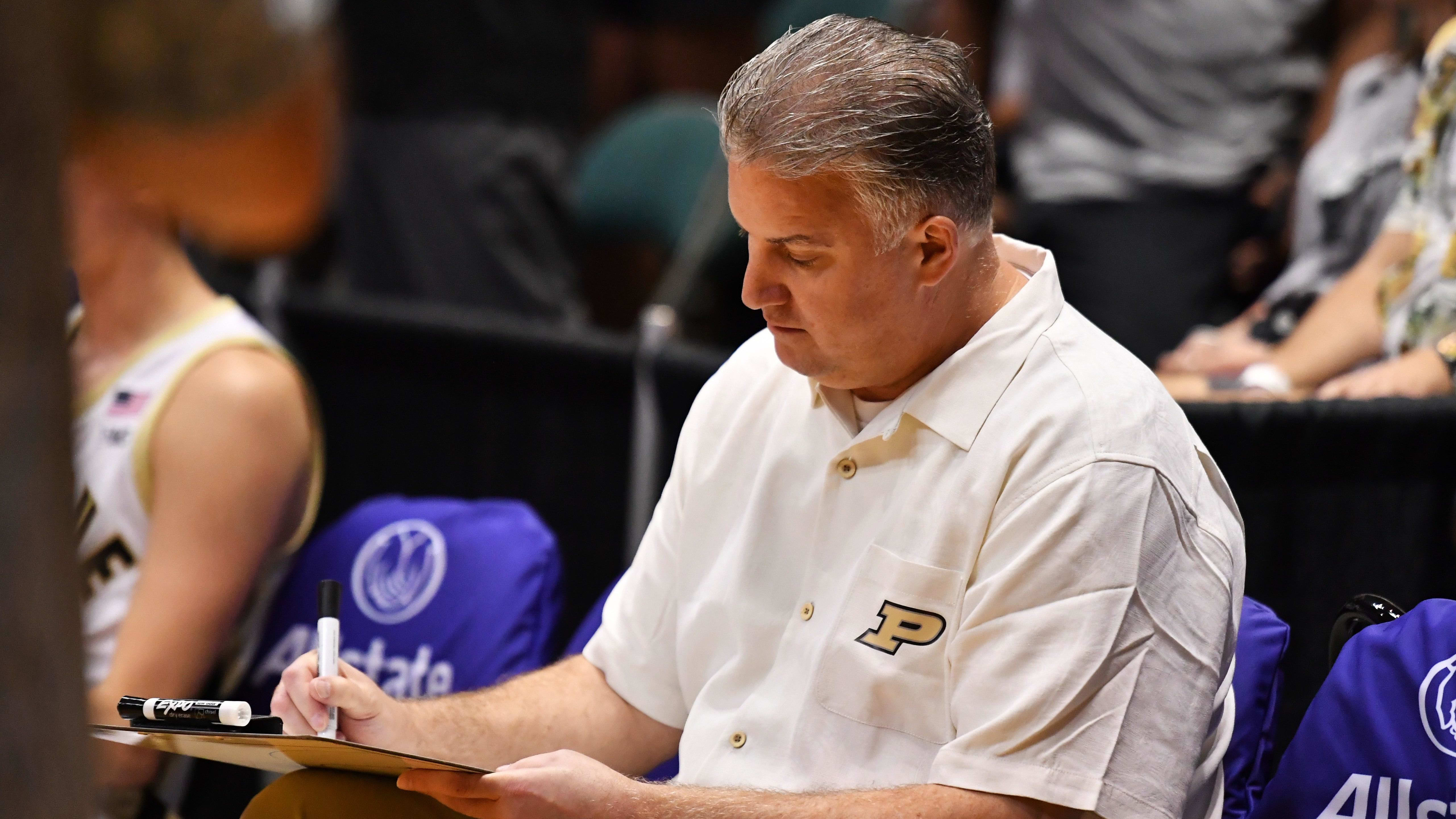 Purdue coach Matt Painter draws up a play against Tennessee last November in Hawaii. The two teams play again on Sunday.