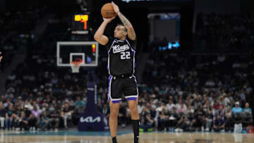 Apr 4, 2025; Charlotte, North Carolina, USA; Sacramento Kings guard Devin Carter (22) with a jump shot against the Charlotte Hornets during the second quarter at Spectrum Center. Mandatory Credit: Jim Dedmon-Imagn Images