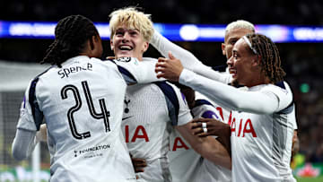 Spurs celebrate their fortuitous winner.