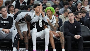 Dec 21, 2024; San Antonio, Texas, USA;  San Antonio Spurs center Victor Wembanyama (1) and forward Jeremy Sochan (10) on the bench in the second half against the Portland Trail Blazers at Frost Bank Center. Mandatory Credit: Daniel Dunn-Imagn Images