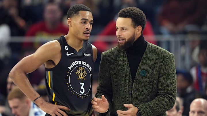 Dec 25, 2022; San Francisco, California, USA; Golden State Warriors guard Stephen Curry (right) talks to guard Jordan Poole (3) during the first quarter against the Memphis Grizzlies at Chase Center. Mandatory Credit: Darren Yamashita-Imagn Images