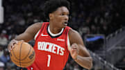 Nov 9, 2025; Milwaukee, Wisconsin, USA;  Houston Rockets guard Amen Thompson (1) drives to the basket against the Milwaukee Bucks in the first half at Fiserv Forum. Mandatory Credit: Michael McLoone-Imagn Images
