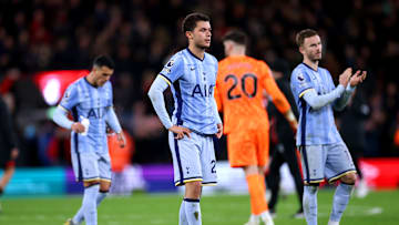 Spurs players acknowledge the travelling fans after the game 