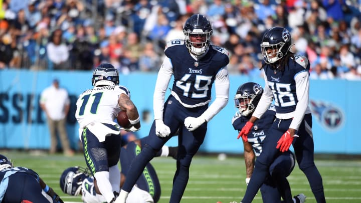 Dec 24, 2023; Nashville, Tennessee, USA; Tennessee Titans linebacker Arden Key (49) celebrates after a defensive stop during the first half against the Seattle Seahawks at Nissan Stadium. Mandatory Credit: Christopher Hanewinckel-USA TODAY Sports