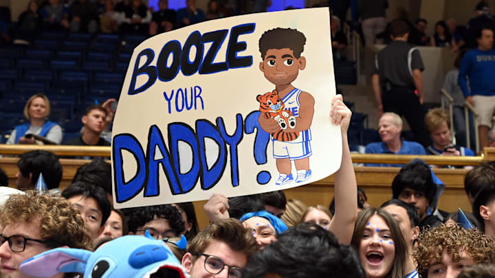 Feb 14, 2026; Durham, North Carolina, USA; A Duke Blue Devils fan holds up a sign prior to a game against the Clemson Tigers at Cameron Indoor Stadium. Mandatory Credit: Rob Kinnan-Imagn Images