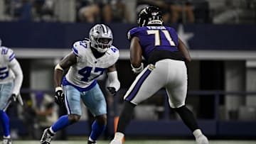 Aug 16, 2025; Arlington, Texas, USA; Dallas Cowboys linebacker Darius Harris (47) and Baltimore Ravens offensive tackle Carson Vinson (71) in action during the game between the Dallas Cowboys and the Baltimore Ravens at AT&T Stadium. Mandatory Credit: Jerome Miron-Imagn Images