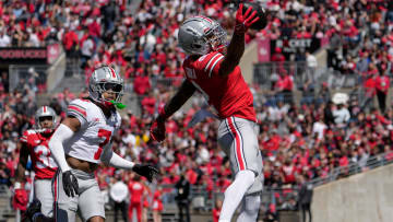April 13, 2024; Columbus, Ohio, USA; 
Ohio State Buckeyes wide receiver Emeka Egbuka (2) catches a pass for the scarlet team while defended by cornerback Jordan Hancock (7) of the grey team during the first half of the LifeSports Spring Game at Ohio Stadium on Saturday.