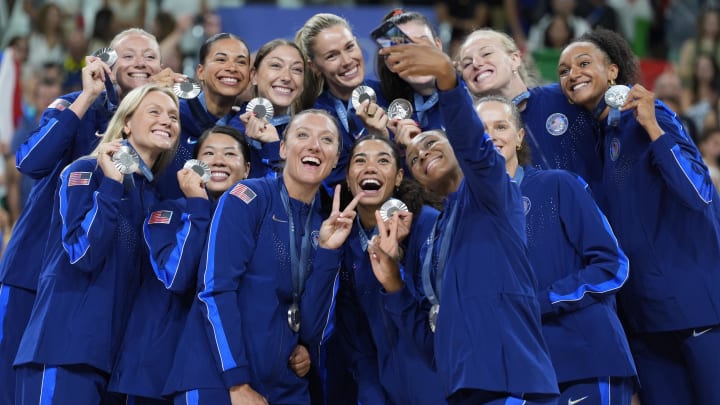 United States volleyball players celebrate with their silver medals 