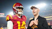 Nov 29, 2025; Los Angeles, California, USA; Southern California Trojans quarterback Jayden Maiava (14) and head coach Lincoln Riley react after the game against the UCLA Bruins at United Airlines Field at Los Angeles Memorial Coliseum. Mandatory Credit: Kirby Lee-Imagn Images