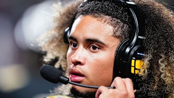 Oct 20, 2023; Carrollton, GA, USA; Carrollton Trojans quarterback Julian Lewis (10) watches on from the sidelines against the Westlake Lions during the first half at Grisham Stadium. The 15-year-old Carrollton High student has already committed to playing for the University of Southern California Trojans and has been considered one of the top high school quarterback prospects. Mandatory Credit: John David Mercer-Imagn Images