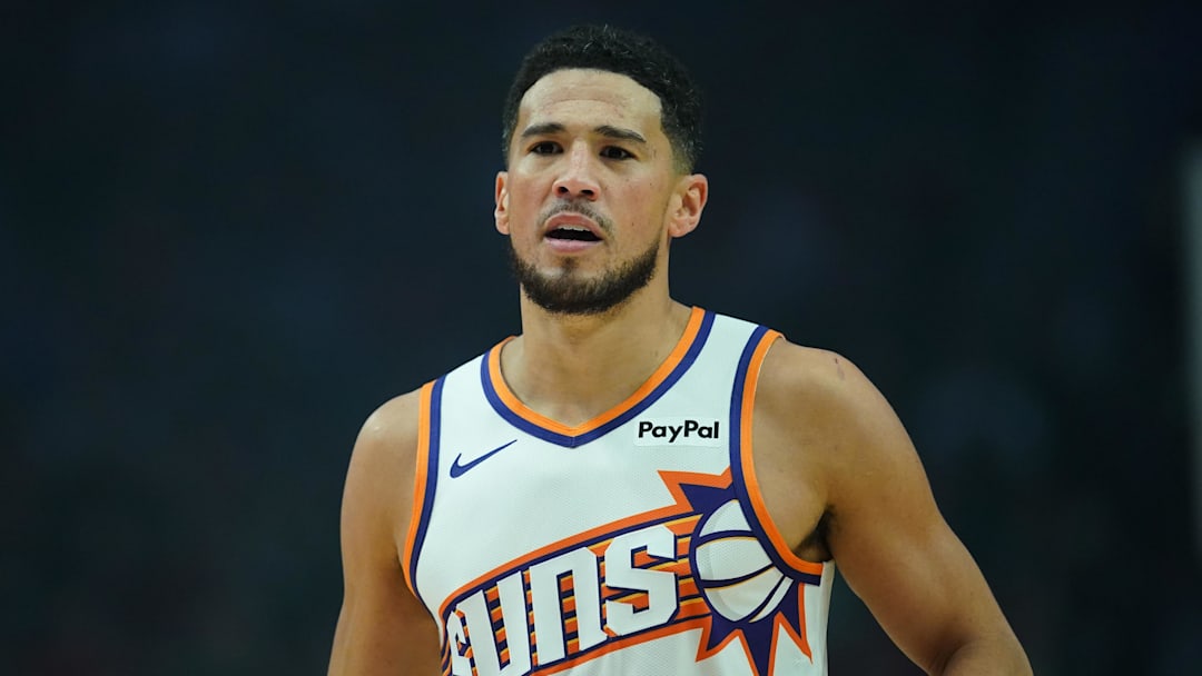 Nov 18, 2025; Portland, Oregon, USA; Phoenix Suns guard Devin Booker (1) looks on during the first half against the Portland Trail Blazers at Moda Center. Mandatory Credit: Soobum Im-Imagn Images