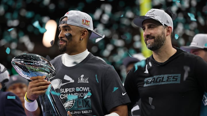 Feb 9, 2025; New Orleans, LA, USA; Philadelphia Eagles quarterback Jalen Hurts holds the Lombardi Trophy while standing next to Eagles head coach Nick Sirianni (R) during the championship trophy presentation after the Eagles' game against the Kansas City Chiefs in Super Bowl LIX at Caesars Superdome. Mandatory Credit: Geoff Burke-Imagn Images