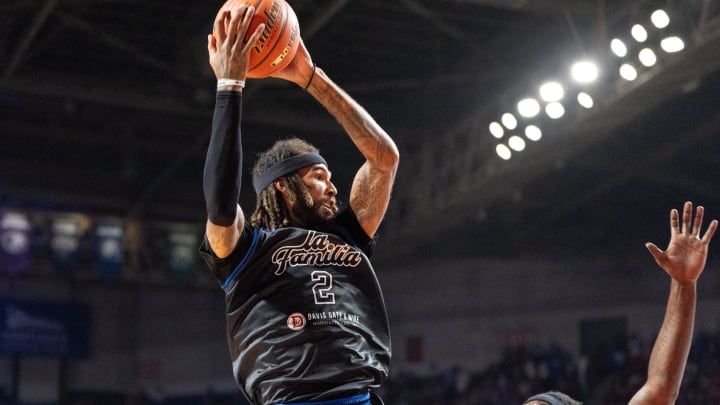 La Familia's Willie Cauley-Stein (2) grabs the rebound against The Ville's Montrezl Harrell (5) during their game on Monday, July 29, 2024 at Freedom Hall in Louisville, Ky. during the quarter finals of The Basketball Tournament.