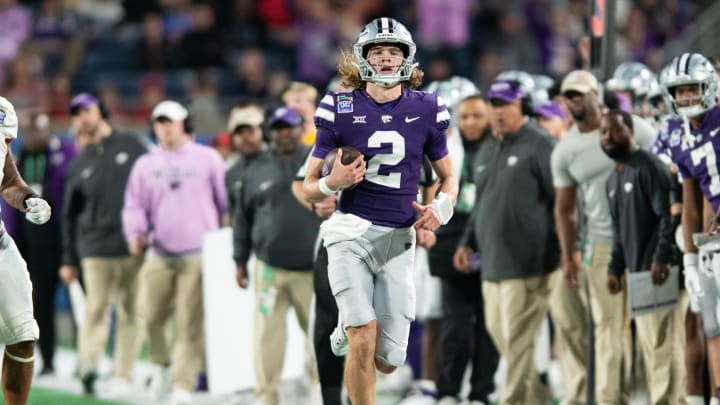 Dec 28, 2023; Orlando, FL, USA; Kansas State quarterback Avery Johnson (2) runs the ball against NC State in the fourth quarter at Camping World Stadium. Mandatory Credit: Jeremy Reper-USA TODAY Sports