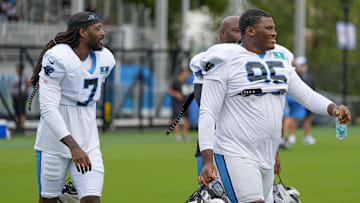 Jul 30, 2024; Charlotte, NC, USA; Carolina Panthers Derrick Brown (95) and linebacker Jadeveon Clowney (7) at Carolina Panthers Practice Fields. Mandatory Credit: Jim Dedmon-Imagn Images