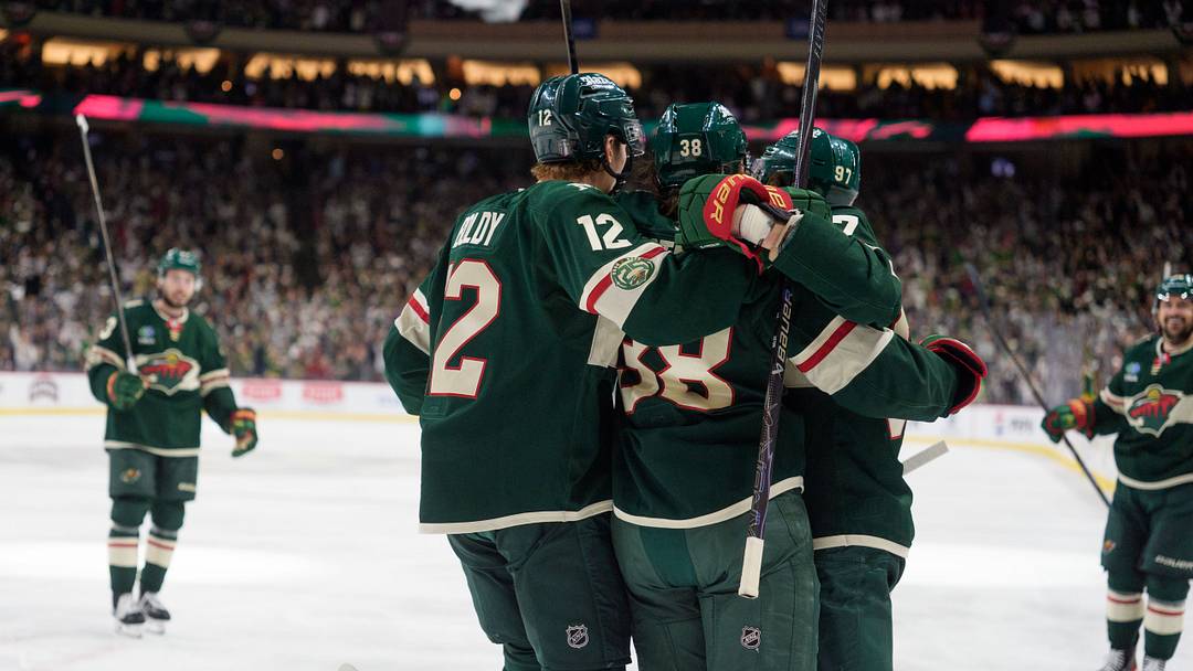 May 9, 2026; Saint Paul, Minnesota, USA; Minnesota Wild right wing Ryan Hartman (38) is congratulated by teammates after scoring on the Colorado Avalanche in the second period of game three of the second round of the 2026 Stanley Cup Playoffs at Grand Casino Arena. Mandatory Credit: Matt Blewett-Imagn Images