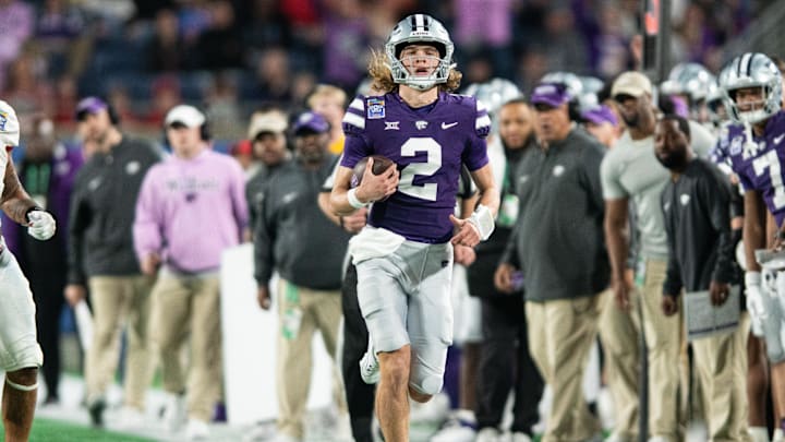Dec 28, 2023; Orlando, FL, USA; Kansas State quarterback Avery Johnson (2) runs the ball against NC State in the fourth quarter at Camping World Stadium. Mandatory Credit: Jeremy Reper-USA TODAY Sports