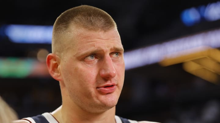 May 12, 2024; Minneapolis, Minnesota, USA; Denver Nuggets center Nikola Jokic (15) speaks with a reporter after defeating the Minnesota Timberwolves at game four of the second round for the 2024 NBA playoffs at Target Center. Mandatory Credit: Bruce Kluckhohn-USA TODAY Sports
