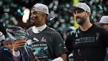 Feb 9, 2025; New Orleans, LA, USA; Philadelphia Eagles quarterback Jalen Hurts holds the Lombardi Trophy while standing next to Eagles head coach Nick Sirianni (R) during the championship trophy presentation after the Eagles' game against the Kansas City Chiefs in Super Bowl LIX at Caesars Superdome. Mandatory Credit: Geoff Burke-Imagn Images
