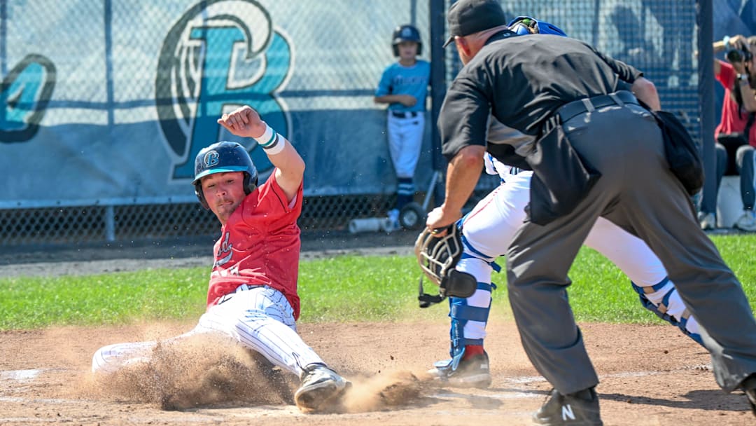 Dalton Wentz of Brewster slides across the plate ahead of the tag by Y-D catcher Connor Capece. Cape League baseball
Aug. 1 2025