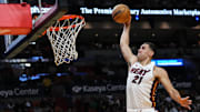 Oct 18, 2023; Miami, Florida, USA; Miami Heat forward Cole Swider (21) dunks the ball against the Brooklyn Nets during the second half at Kaseya Center. Mandatory Credit: Rich Storry-Imagn Images