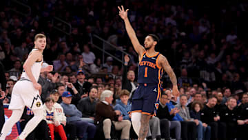 Jan 29, 2025; New York, New York, USA; New York Knicks guard Cameron Payne (1) celebrates his three point shot against Denver Nuggets guard Christian Braun (0) during the first quarter at Madison Square Garden. Mandatory Credit: Brad Penner-Imagn Images