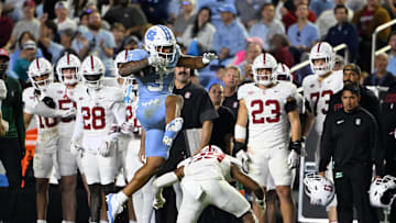 Nov 8, 2025; Chapel Hill, North Carolina, USA; North Carolina Tar Heels running back Davion Gause (37) jumps overStanford Cardinal safety Darrius Davis (29) in the third quarter at Kenan Stadium. Mandatory Credit: Bob Donnan-Imagn Images