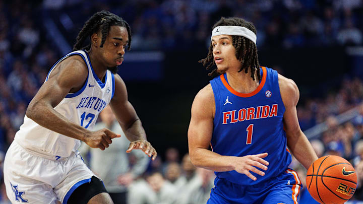 Jan 31, 2024; Lexington, Kentucky, USA; Florida Gators guard Walter Clayton Jr. (1) handles the ball against Kentucky Wildcats guard Antonio Reeves (12) during the first half at Rupp Arena at Central Bank Center. Mandatory Credit: Jordan Prather-Imagn Images