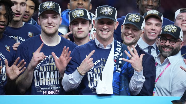 Apr 8, 2024; Glendale, AZ, USA;  Connecticut Huskies head coach Dan Hurley and his players celebrate after defeating the Purdue Boilermakers in the national championship game of the Final Four of the 2024 NCAA Tournament at State Farm Stadium. Mandatory Credit: Robert Deutsch-USA TODAY Sports